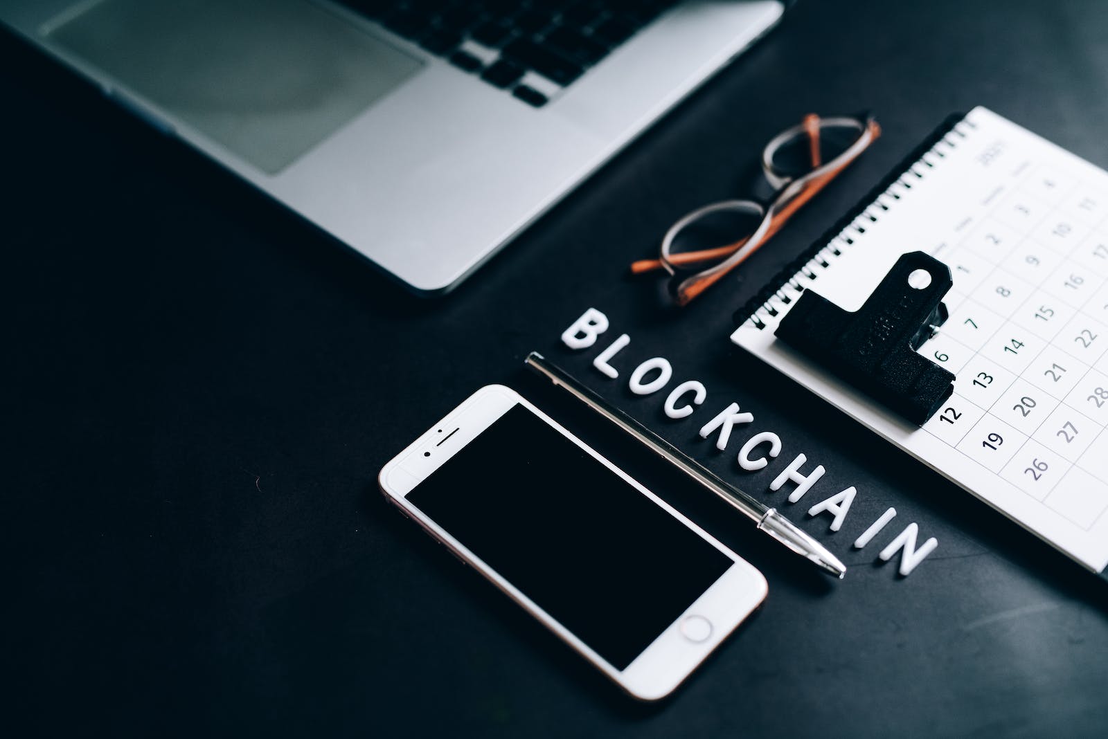 Smartphone, Pen, Calendar and Eyeglasses on Flat Surface