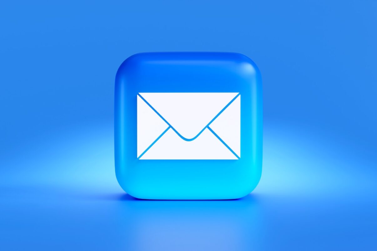 a blue button with a white envelope on it