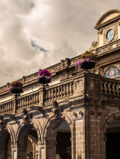 a large building with a clock on the top of it